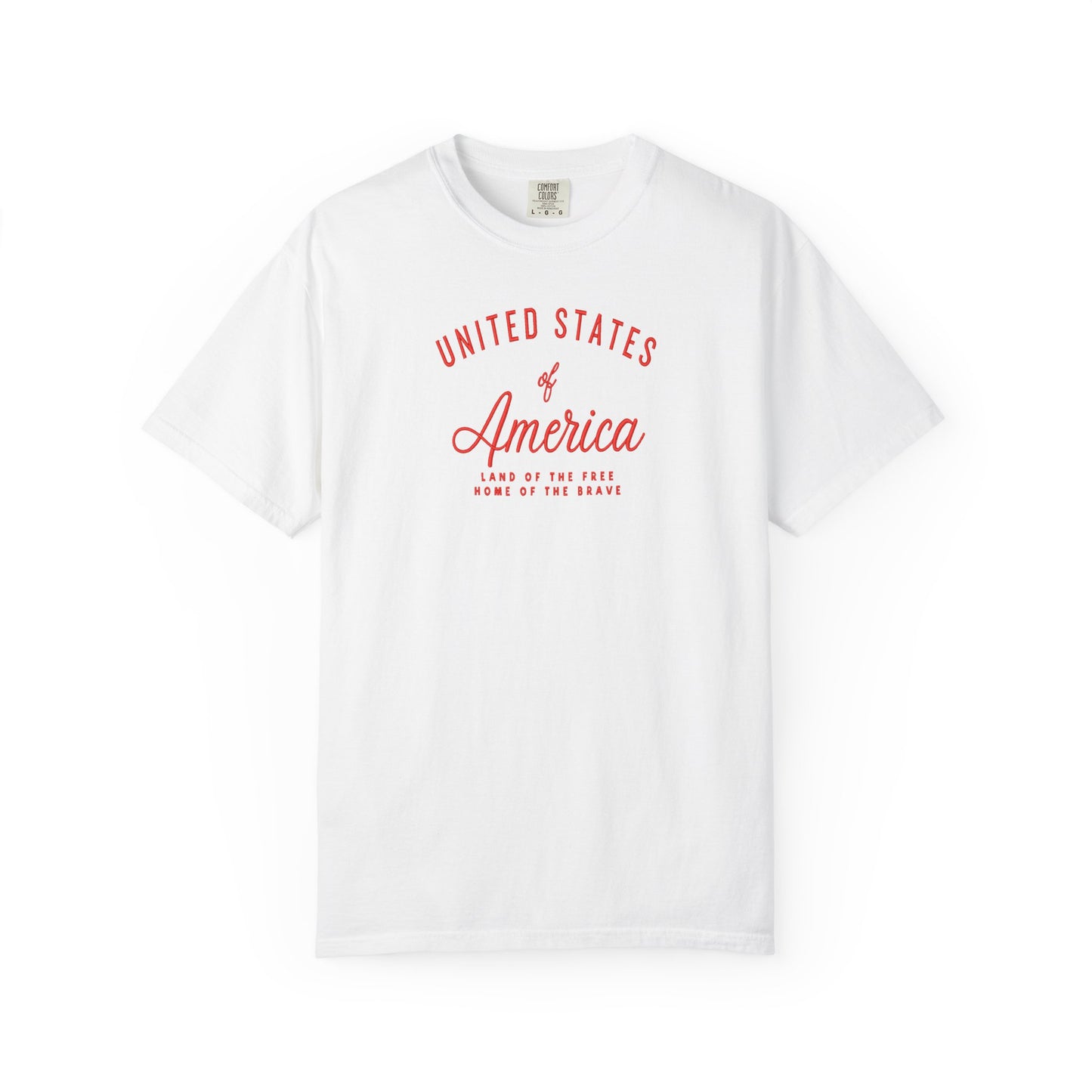 White patriotic USA t-shirt featuring “United States of America” red graphic text with Land of the Free Home of the Brave design for 4th of July and Independence Day wear