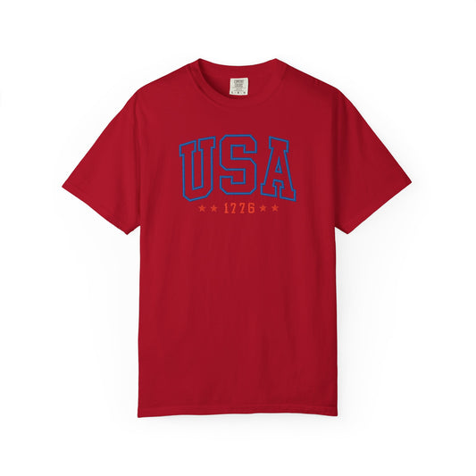 Red patriotic USA t-shirt featuring “USA 1776” blue graphic text with USA 1776 design for 4th of July and Independence Day wear