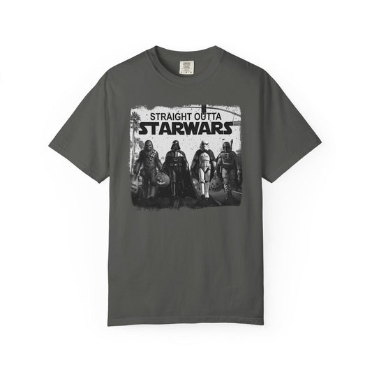 Grey short-sleeve graphic t-shirt featuring a black and white design with iconic Star Wars characters including Chewbacca, Darth Vader, Stormtrooper, and Boba Fett walking together across a crosswalk. Above them, bold text reads “Straight Outta Starwars.” The print has a distressed, vintage style with palm trees and a traffic light in the background, blending pop culture and urban streetwear vibes.