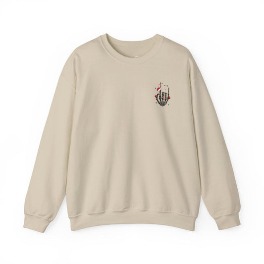 Beige sweatshirt with a small graphic on the chest against a white background