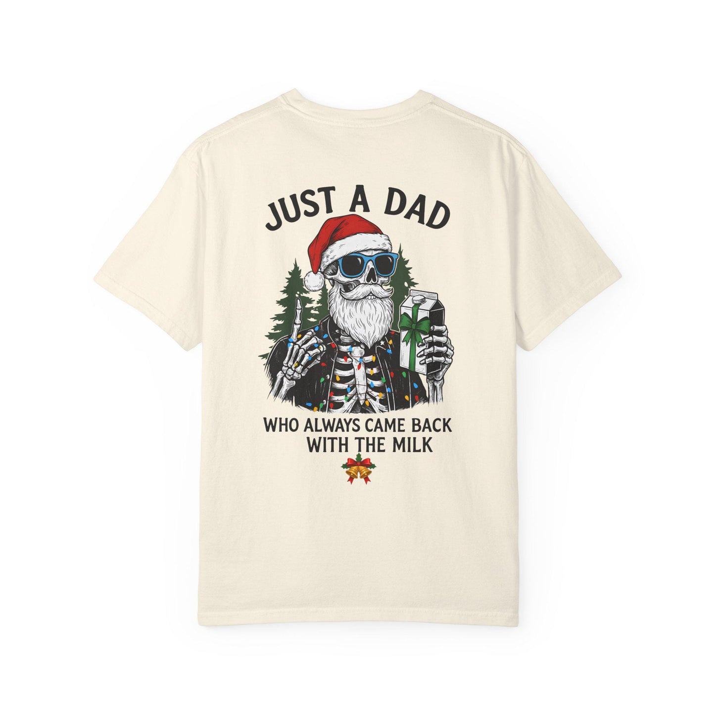 Beige t-shirt with a graphic of a skeleton wearing a Santa hat and sunglasses, holding a glass of milk, with text on a white background.
