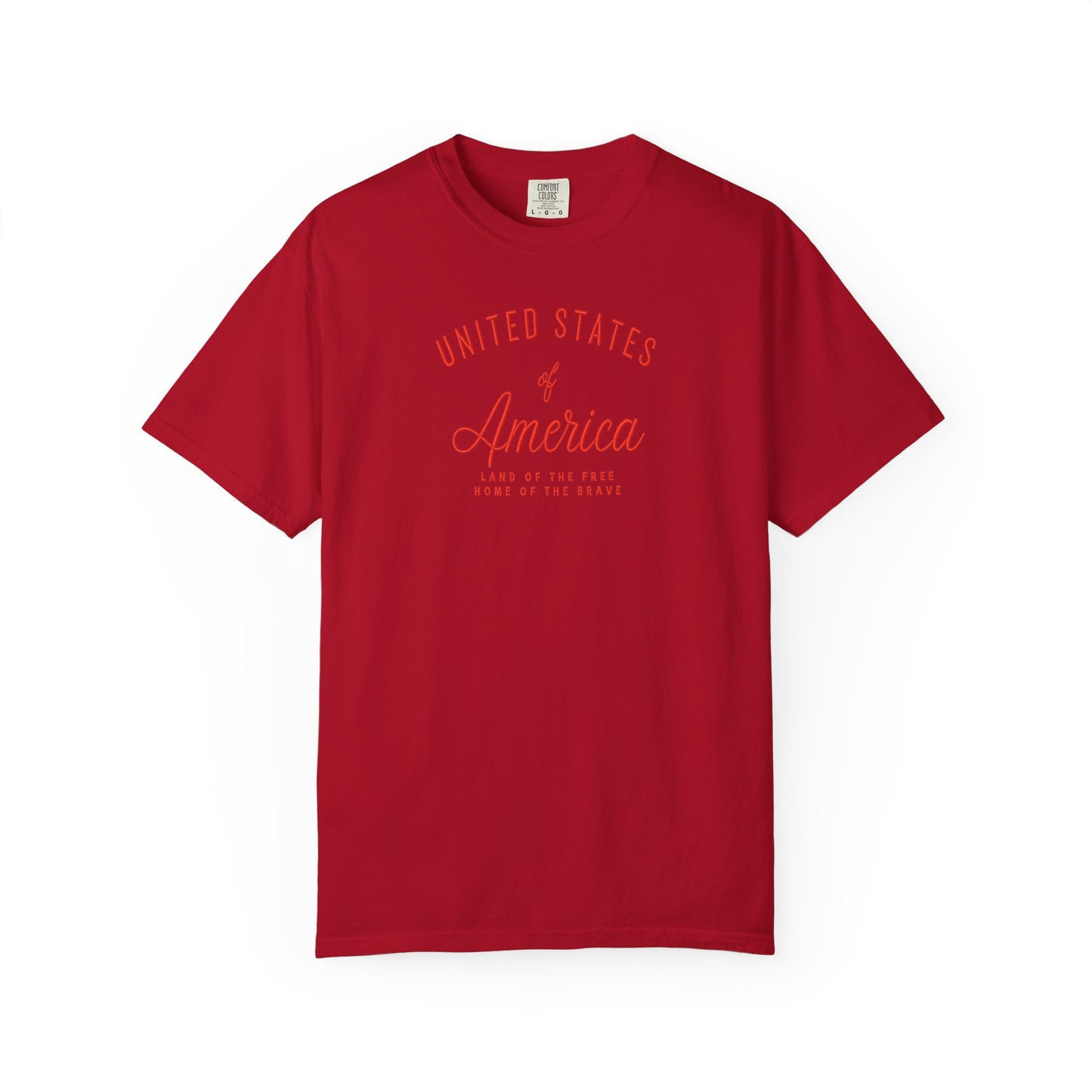 Red patriotic USA t-shirt featuring “United States of America” red graphic text with Land of the Free Home of the Brave design for 4th of July and Independence Day wear