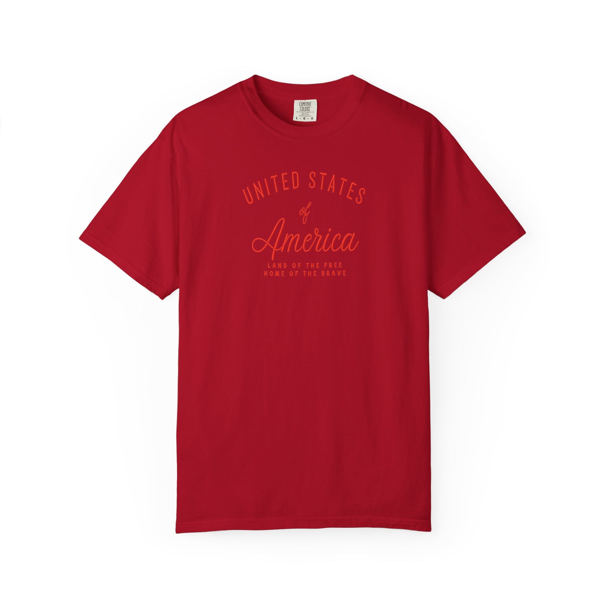 Red patriotic USA t-shirt featuring “United States of America” red graphic text with Land of the Free Home of the Brave design for 4th of July and Independence Day wear