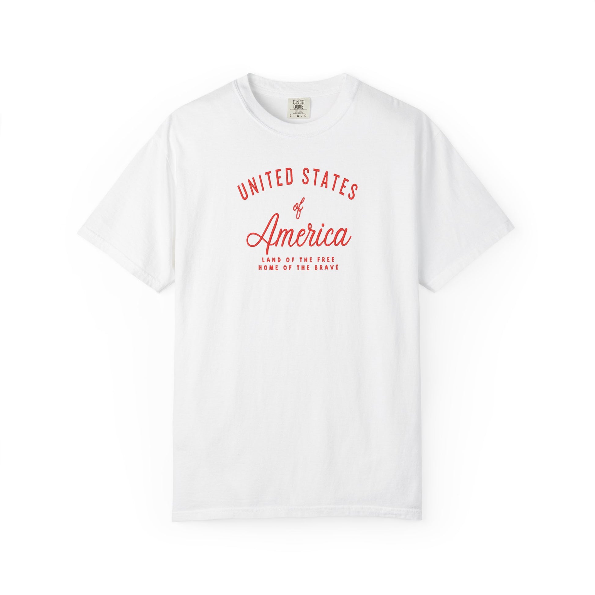 White patriotic USA t-shirt featuring “United States of America” red graphic text with Land of the Free Home of the Brave design for 4th of July and Independence Day wear