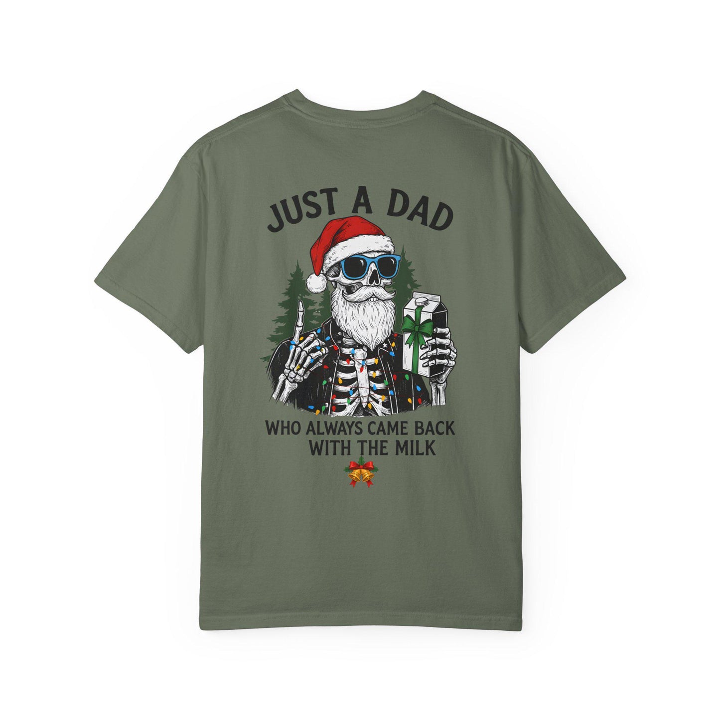 Green t-shirt with a skeleton wearing a Santa hat and sunglasses holding a gift, text 'Just a dad who always came back with the milk' on a white background.