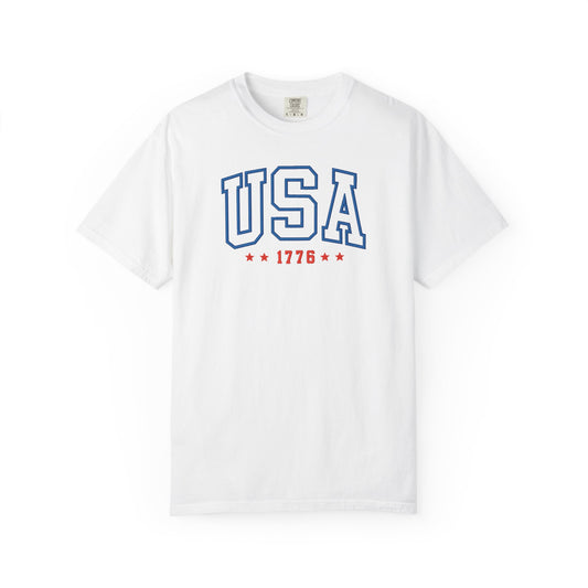 White patriotic USA t-shirt featuring “USA 1776” blue graphic text with USA 1776 design for 4th of July and Independence Day wear