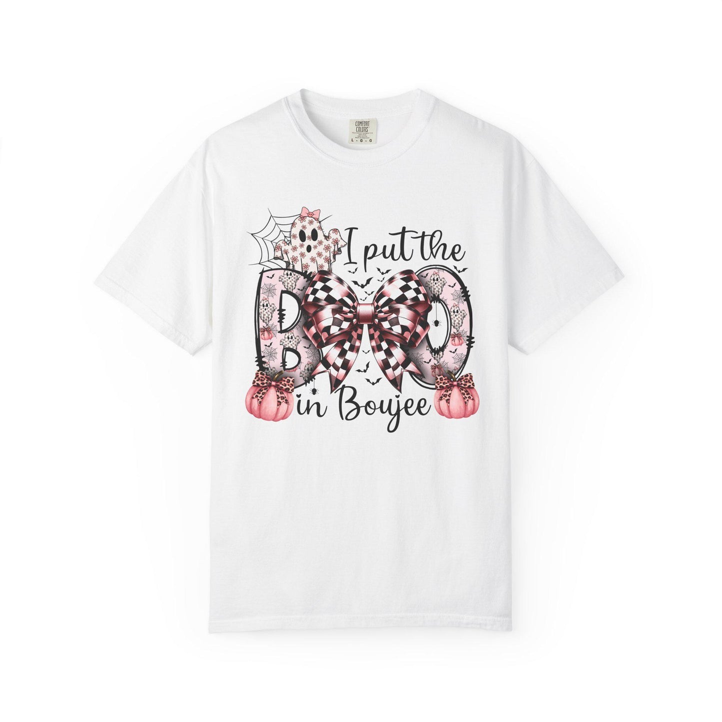 White short-sleeve t-shirt with a playful Halloween-themed design that reads “I put the BOO in Boujee.” The word “BOO” is decorated with black and pink patterns, including leopard print and buffalo plaid, accented by a large checkered bow. Surrounding the text are cute seasonal details such as pink pumpkins, a ghost, bats, and a spider web, giving the shirt a stylish and boujee spooky vibe.