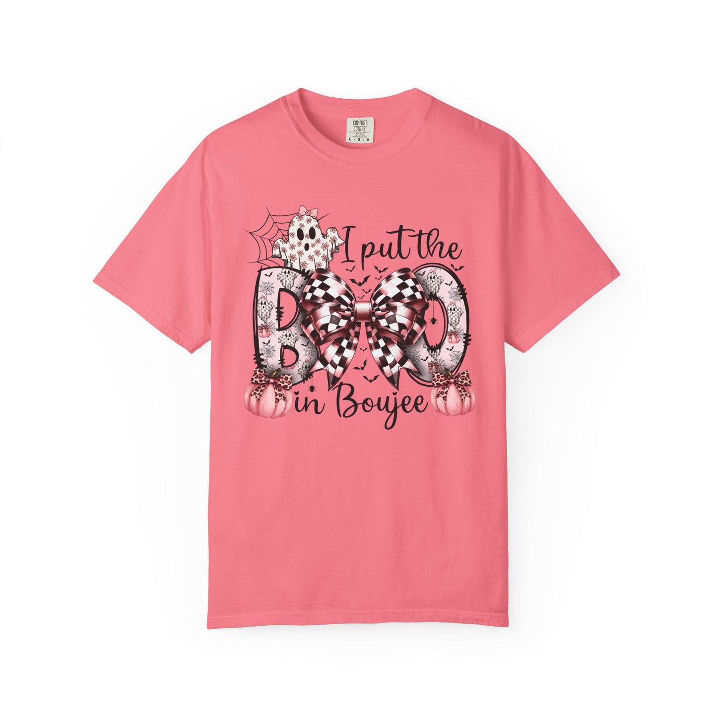 Watermelon short-sleeve t-shirt with a playful Halloween-themed design that reads “I put the BOO in Boujee.” The word “BOO” is decorated with black and pink patterns, including leopard print and buffalo plaid, accented by a large checkered bow. Surrounding the text are cute seasonal details such as pink pumpkins, a ghost, bats, and a spider web, giving the shirt a stylish and boujee spooky vibe.